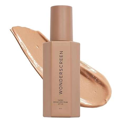 Mineral Sunscreen tinted broad spectrum SPF 30 in beige bottle with smooth creamy texture background