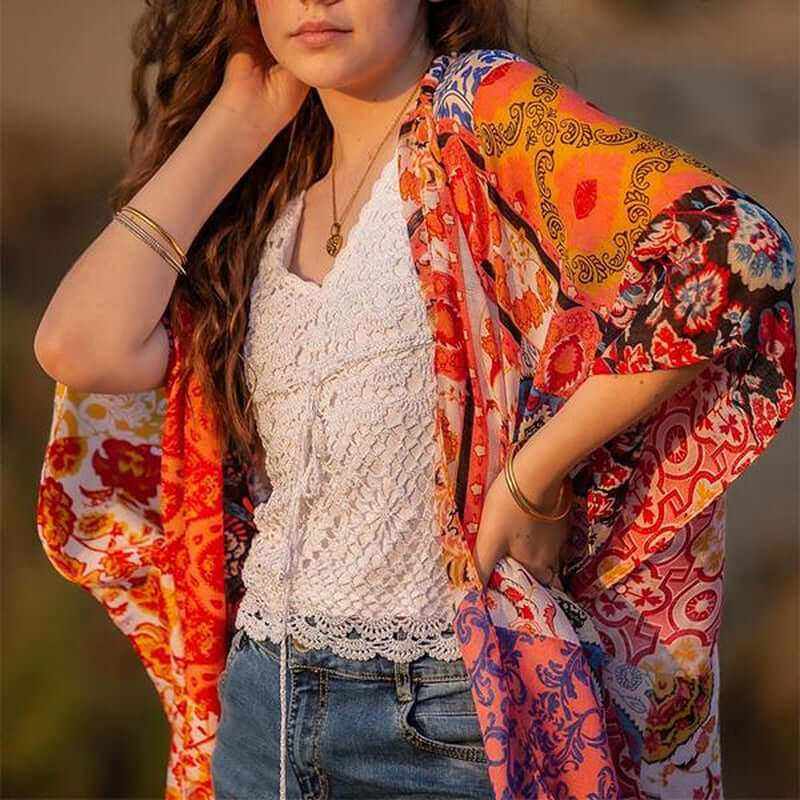 Bohemian floral swimsuit cover up displayed on model at the beach