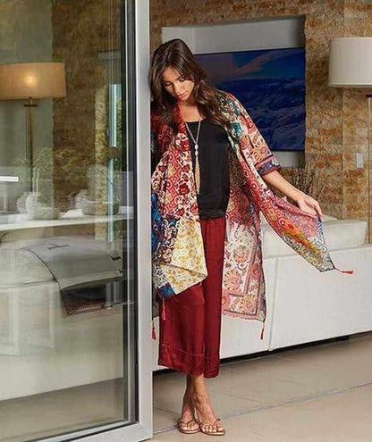 Bohemian floral swimsuit cover up displayed on model at the beach