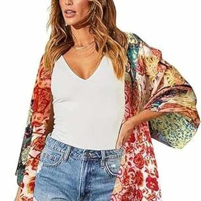 Bohemian floral swimsuit cover up displayed on model at the beach