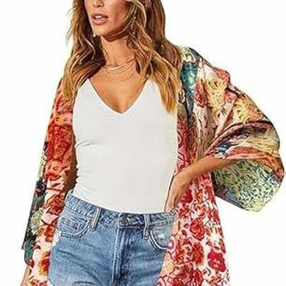 Bohemian floral swimsuit cover up displayed on model at the beach