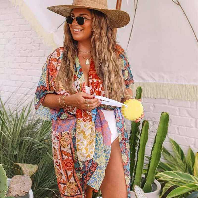 Bohemian floral swimsuit cover up displayed on model at the beach