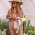Bohemian floral swimsuit cover up displayed on model at the beach